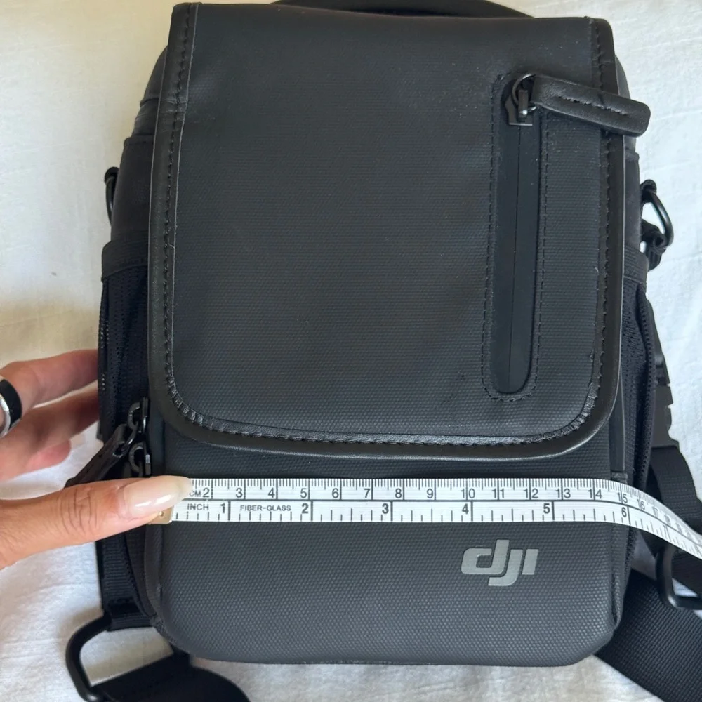 DJI Mavic Black Messenger Bag with Adjustable Strap and Minimalist Design